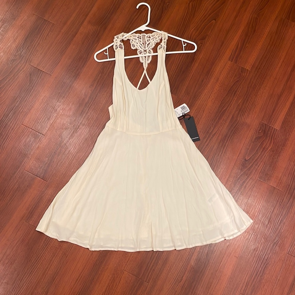 Small off white dress with fun back